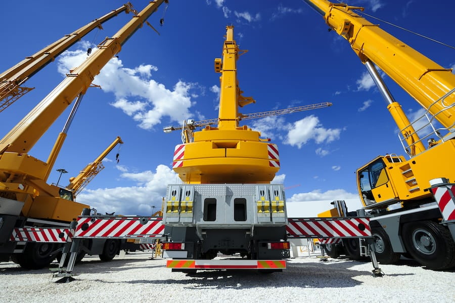 Yellow cranes on a lot
